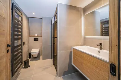 a bathroom with a sink and a toilet at Paradisa Penthouse in Chamonix-Mont-Blanc