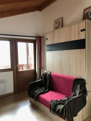 a couch in a room with a bunk bed at OLCA Les Houches in Les Houches