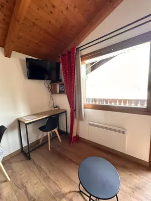 a small room with a desk and a window at OLCA Les Houches in Les Houches