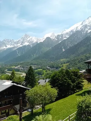 a view of the mountains from a house at OLCA Les Houches in Les Houches