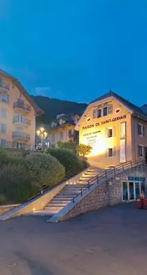 a building with stairs in front of a building at Appartement 14 - Résidence Conseil au coeur du village in Saint-Gervais-les-Bains