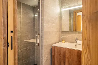a bathroom with a sink and a shower at Paradisa Mer de Glace Elegant brand new 3-bedroom apartment in Chamonix-Mont-Blanc