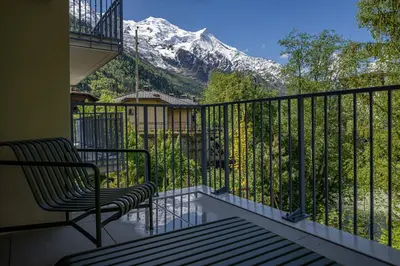 a balcony with a view of a snow covered mountain at Paradisa Mer de Glace Elegant brand new 3-bedroom apartment in Chamonix-Mont-Blanc