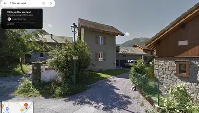 a house with a street sign in front of it at Chalet Tomsine in Samoëns