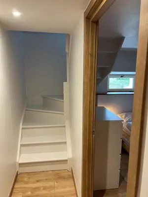 a walk in closet with stairs in a room at Chalet Tomsine in Samoëns