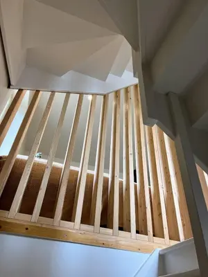 an overhead view of a wooden staircase in a house at Chalet Tomsine in Samoëns