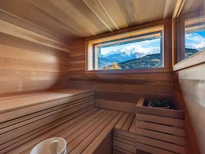 a sauna with a window in a wooden cabin at Chalet 180 I Le Chalet Club in Combloux
