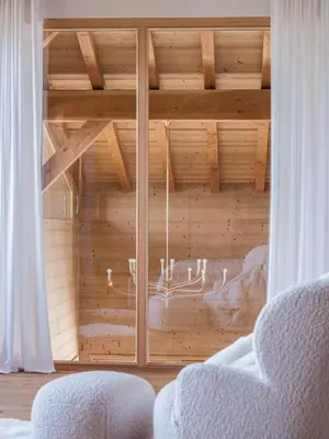 a room with a large wooden cabinet with a window at Chalet 180 I Le Chalet Club in Combloux