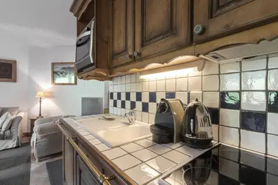 a kitchen with a sink and a microwave at Grande Jorasses 2 - Ski - Terrasse - Vue Montagne in Les Houches