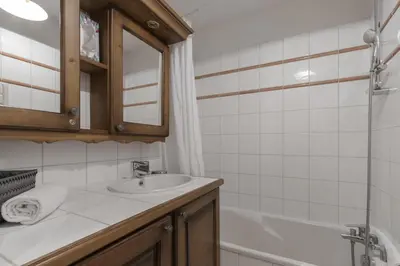 a bathroom with a sink and a bath tub at Grande Jorasses 2 - Ski - Terrasse - Vue Montagne in Les Houches