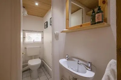 a bedroom with a bunk bed with a tray of food at Résidence Grand Roc - Bruyères 220 - Happy Rentals in Chamonix-Mont-Blanc
