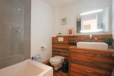 a bathroom with a sink and a toilet and a tub at Alpine Museum- Chamonix All Year in Chamonix-Mont-Blanc