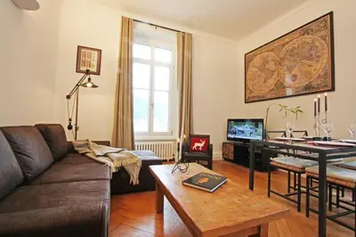 a living room with a couch and a table at Alpine Museum- Chamonix All Year in Chamonix-Mont-Blanc