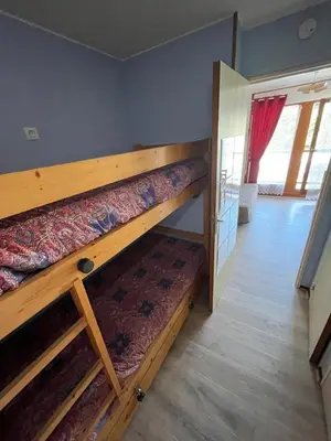 a bedroom with two bunk beds in a room at Studio Contamines-Montjoie in Les Contamines-Montjoie