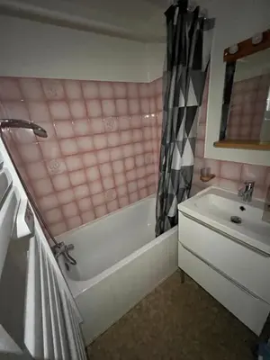 a pink bathroom with a tub and a sink at Studio Contamines-Montjoie in Les Contamines-Montjoie