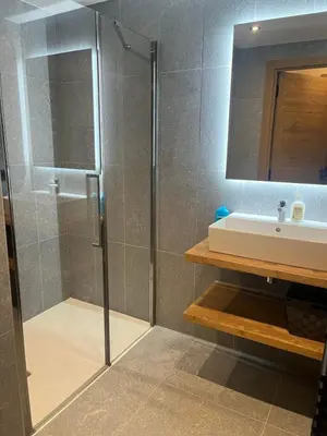a bathroom with a shower and a sink at Megeve Praz sur Arly Apparthotel eclat des veriaz Studio vue sur jardin in Megève
