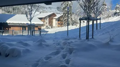 a pile of snow in front of a house at Megeve Praz sur Arly Apparthotel eclat des veriaz Studio vue sur jardin in Megève