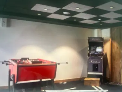 a room with a pool table next to a machine at Megeve Praz sur Arly Apparthotel eclat des veriaz Studio vue sur jardin in Megève