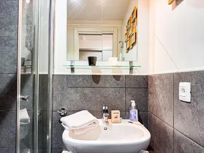 a bathroom with a sink and a shower at Studio 4810 Centre Chamonix in Chamonix-Mont-Blanc