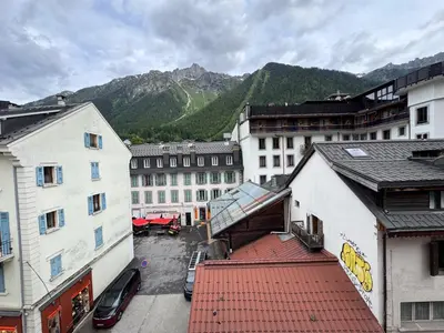 an empty street in a city with buildings at Studio 4810 Centre Chamonix in Chamonix-Mont-Blanc