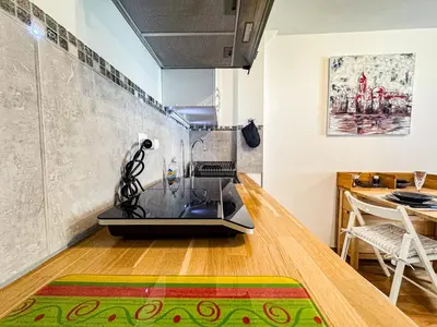 a kitchen and dining room with a table and chairs at Studio 4810 Centre Chamonix in Chamonix-Mont-Blanc