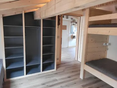 a room with bunk beds in a tiny house at Le Top des Praz in Chamonix-Mont-Blanc