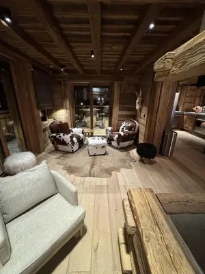 a living room with couches and chairs in a building at Chalet de Luxe - Centre-Ville in Megève