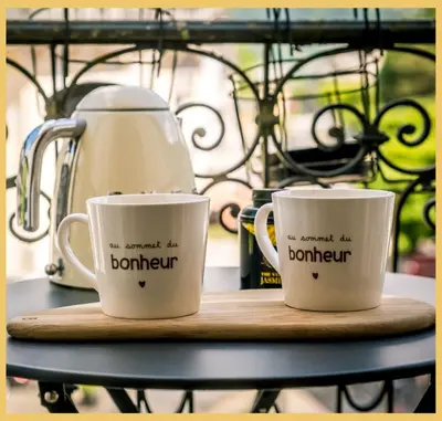 a table with wine glasses and plates on it at Appartement La Comtesse I Centre de Saint-Gervais in Saint-Gervais-les-Bains