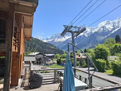 a balcony with a view of a mountain at Chalet du Verney - Pied du Prarion - Sauna in Les Houches