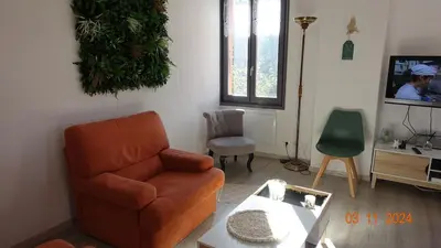 a living room with a couch and a chair at La Comtesse in Saint-Gervais-les-Bains