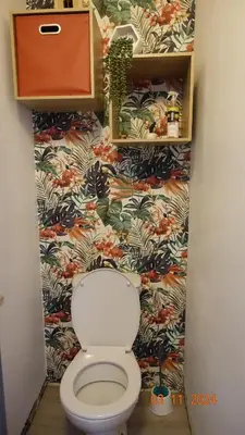 a bathroom with a toilet with a floral wallpaper at La Comtesse in Saint-Gervais-les-Bains