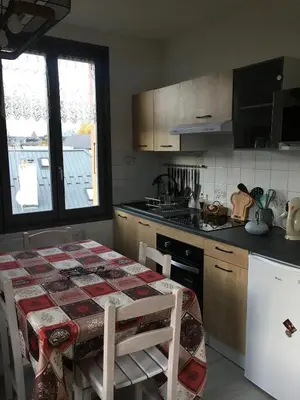 a kitchen with a table and a counter top at La Comtesse in Saint-Gervais-les-Bains