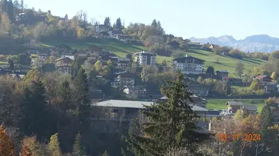 a village on a hill with houses and trees at La Comtesse in Saint-Gervais-les-Bains