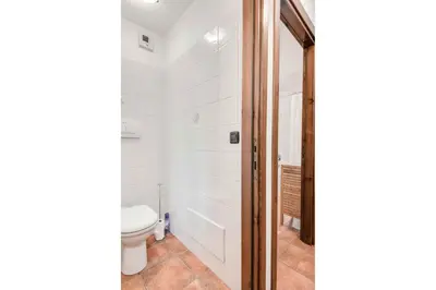 a bathroom with a toilet and a shower at Apartment Balmat - Chamonix All Year in Chamonix-Mont-Blanc
