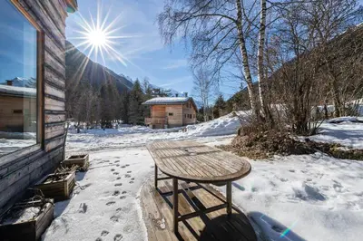 a picnic table in the snow on a house at Chalet Altiora in Chamonix-Mont-Blanc