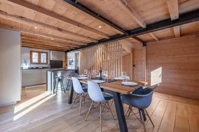 a kitchen and dining room with a table and chairs at Chalet Altiora in Chamonix-Mont-Blanc