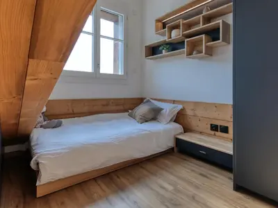 two bunk beds in a room with wooden ceilings at Duplex moderne 5 pièces, 4 chambres, 10 pers., WiFi, parking, proche centre - FR-1-663-48 in Saint-Gervais-les-Bains