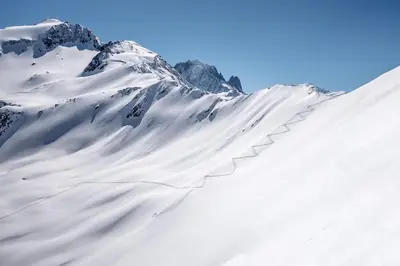a snow covered mountain with a snow covered slope at Chalet Tannuaz - 4 Bedrooms - Quiet area - By Cozee Rentals in Les Houches