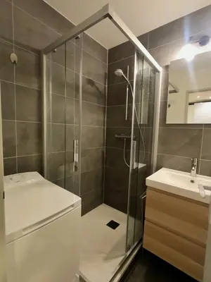 a bathroom with a shower and a sink at Beautiful cozy and fully renovated apartment in Chamonix-Mont-Blanc