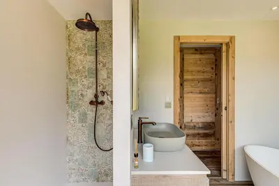 a bathroom with a shower and a toilet and a sink at Chalet Papillon - Alpes Travel - Detached Chalet - Les Praz - Sleeps 8-10 in Chamonix-Mont-Blanc