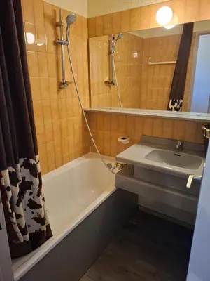 a bathroom with a tub and a sink and a shower at Cham sud in Chamonix-Mont-Blanc