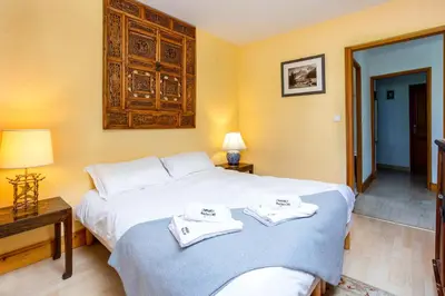 a hotel room with a bed with towels on it at Le Brevent apartment -Chamonix All Year in Chamonix-Mont-Blanc