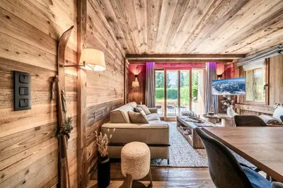 a living room with a couch and a table at Apartment Brume Megève - by EMERALD STAY in Megève