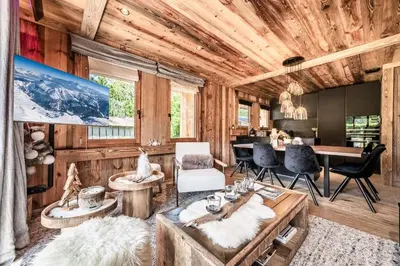a living room with wood paneling and a wooden ceiling at Apartment Brume Megève - by EMERALD STAY in Megève