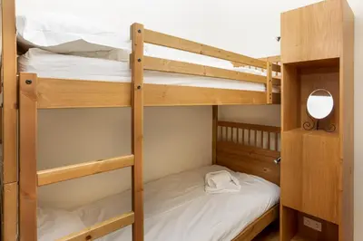 a bunk bed room with two bunk beds at Le Majestic 76 - Chamonix All Year in Chamonix-Mont-Blanc