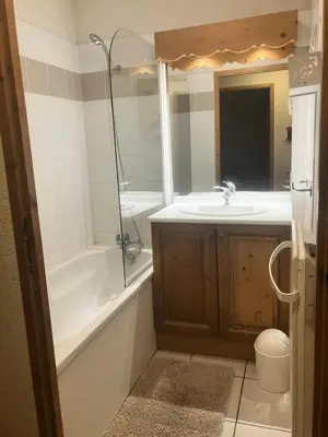 a bathroom with a tub and a sink and a bath tub at Résidence Le Grand Panorama - Grand Panorama 315 MAE-0623 in Saint-Gervais-les-Bains