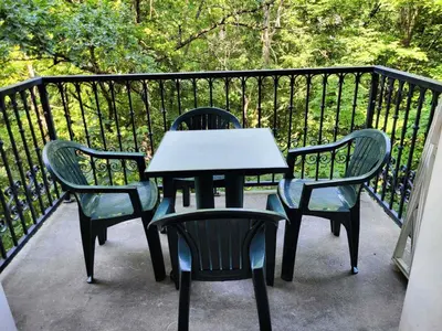 two chairs and a table on a balcony at Résidence Le Grand Panorama - Grand Panorama 315 MAE-0623 in Saint-Gervais-les-Bains