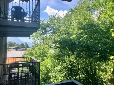 a balcony of a building with trees in the background at Résidence Le Grand Panorama - Grand Panorama 315 MAE-0623 in Saint-Gervais-les-Bains