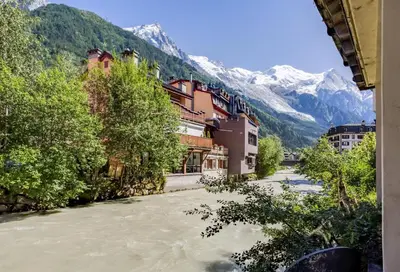 a view of a river with mountains in the background at Lou Lou Apartment - Chamonix All Year in Chamonix-Mont-Blanc