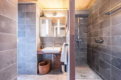 a bathroom with a sink and a shower at Apartment with balcony 10 min walk from the slopes in Megève